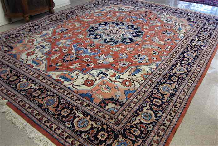 Appraisal: HAND KNOTTED ORIENTAL CARPET Persian Heriz design ' '' x