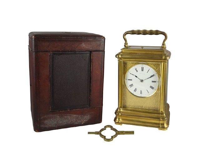 Appraisal: A large gilt brass repeating carriage clock with rectangular moulded