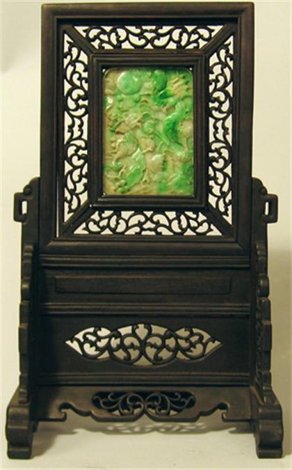 Appraisal: Chinese jade and hardwood table screen The tall rectangular insert