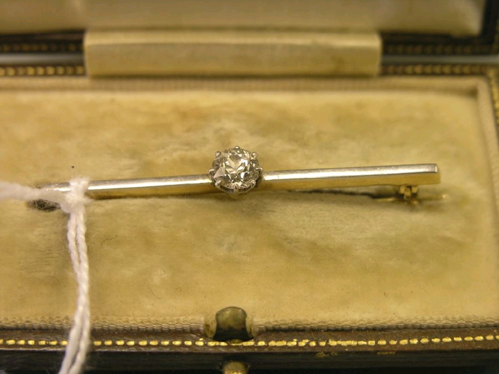 Appraisal: A diamond bar brooch single stone approximately ct within claw