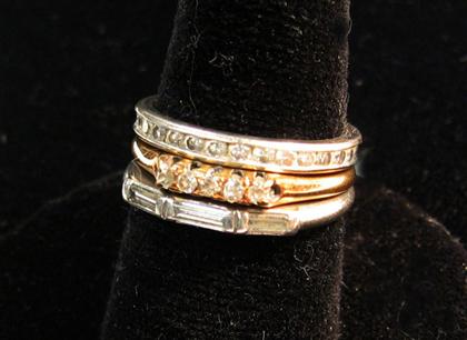 Appraisal: Two platinum and diamond wedding bands twentieth century One by