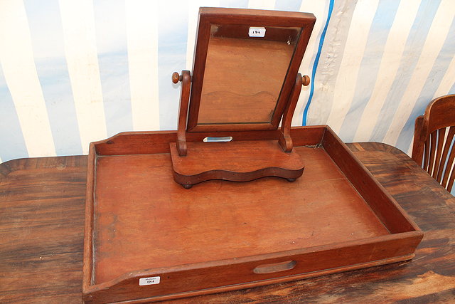 Appraisal: A TH CENTURY MAHOGANY BUTLER'S TRAY and a toilet mirror