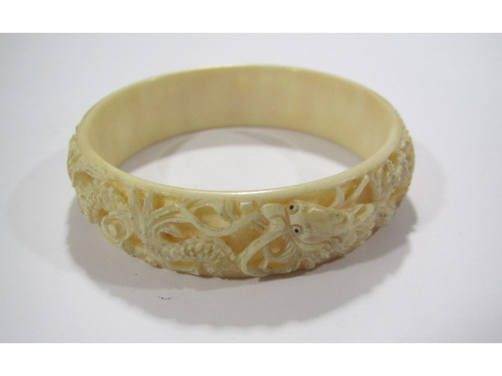 Appraisal: Chinese carved ivory bangle depicting dragons