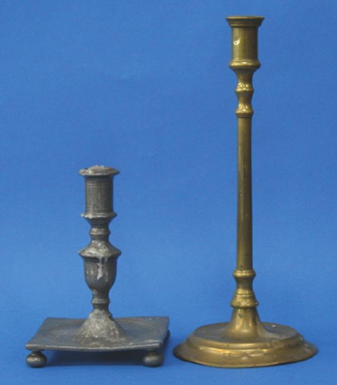 Appraisal: A TALL BRASS CANDLESTICK with a straight-sided sconce on a