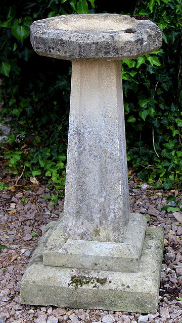 Appraisal: A CARVED STONE BIRD BATH with an octagonal bowl on