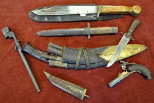 Appraisal: A Bowie-style hunting knife a Kukri a percussion lock muff