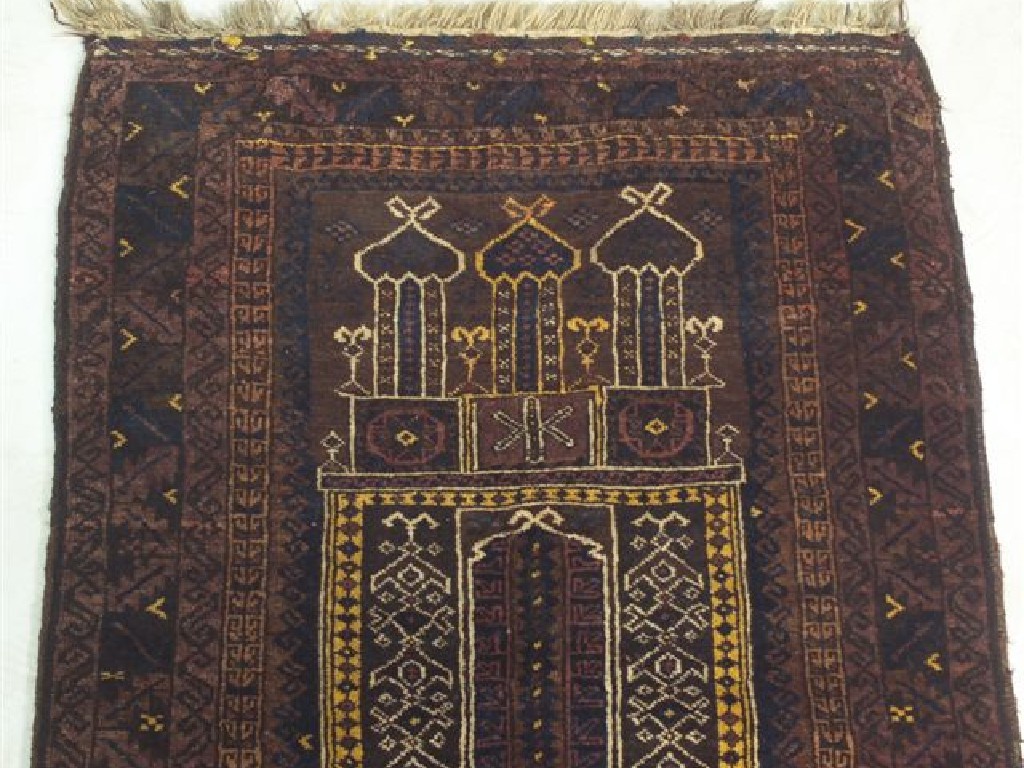 Appraisal: BALUCHI PRAYER RUG with a brown ground m by m