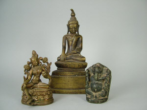 Appraisal: A Sino-Tibetan patinated bronze figure of a seated deity cm