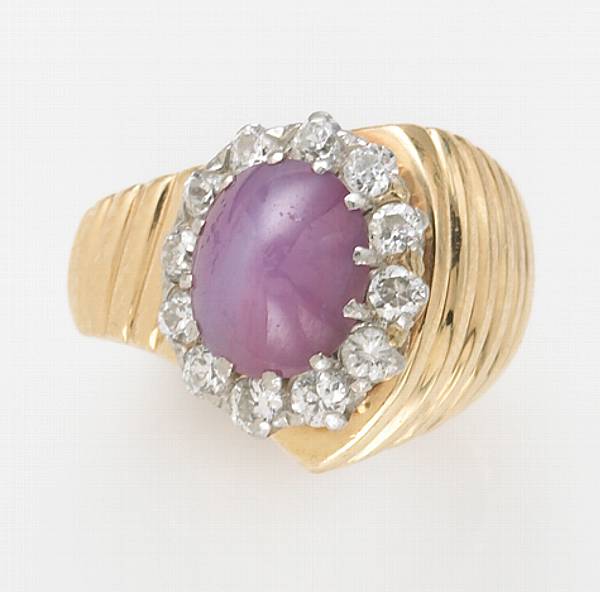 Appraisal: A purple star sapphire diamond and k gold ring