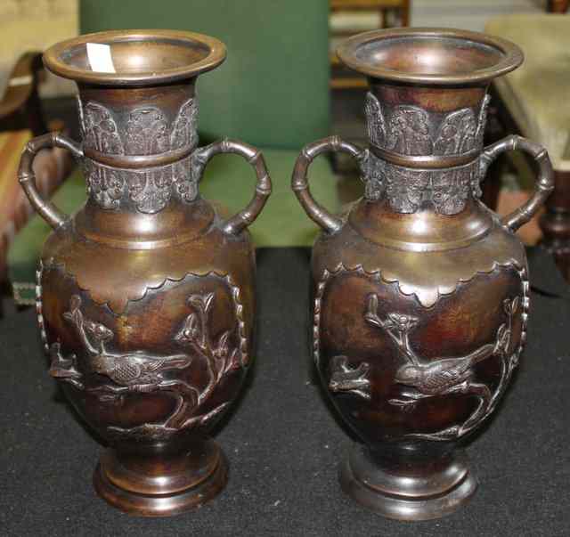 Appraisal: A PAIR OF JAPANESE BRONZE VASES of baluster form with