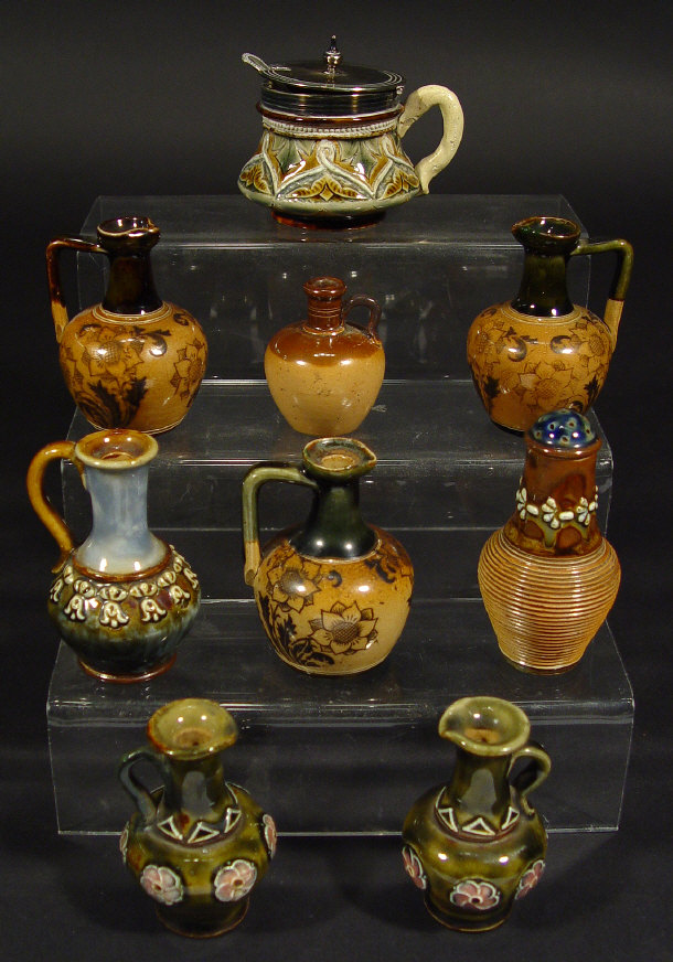 Appraisal: Seven Doulton Lambeth stoneware miniature jugs a pepperette and a