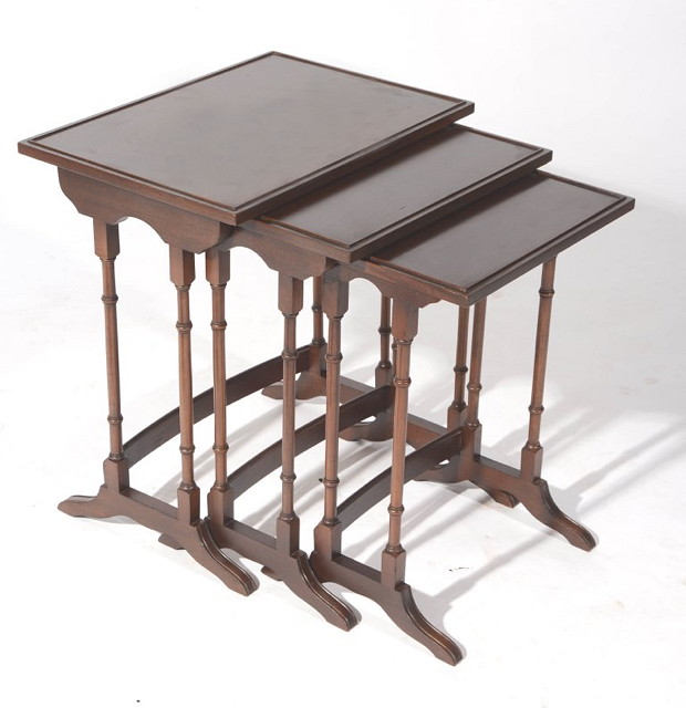 Appraisal: A NEST OF THREE EDWARDIAN MAHOGANY OCCASIONAL TABLES each with