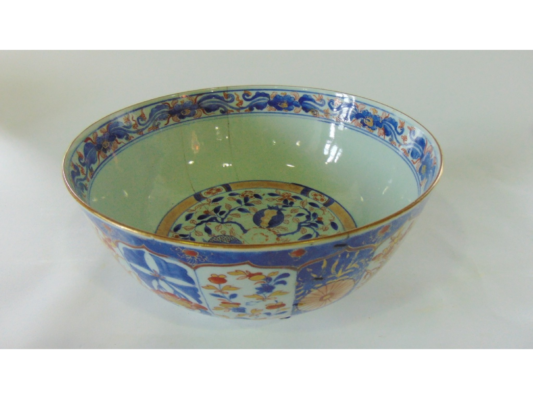 Appraisal: A th century Imari type punch bowl with painted gilded