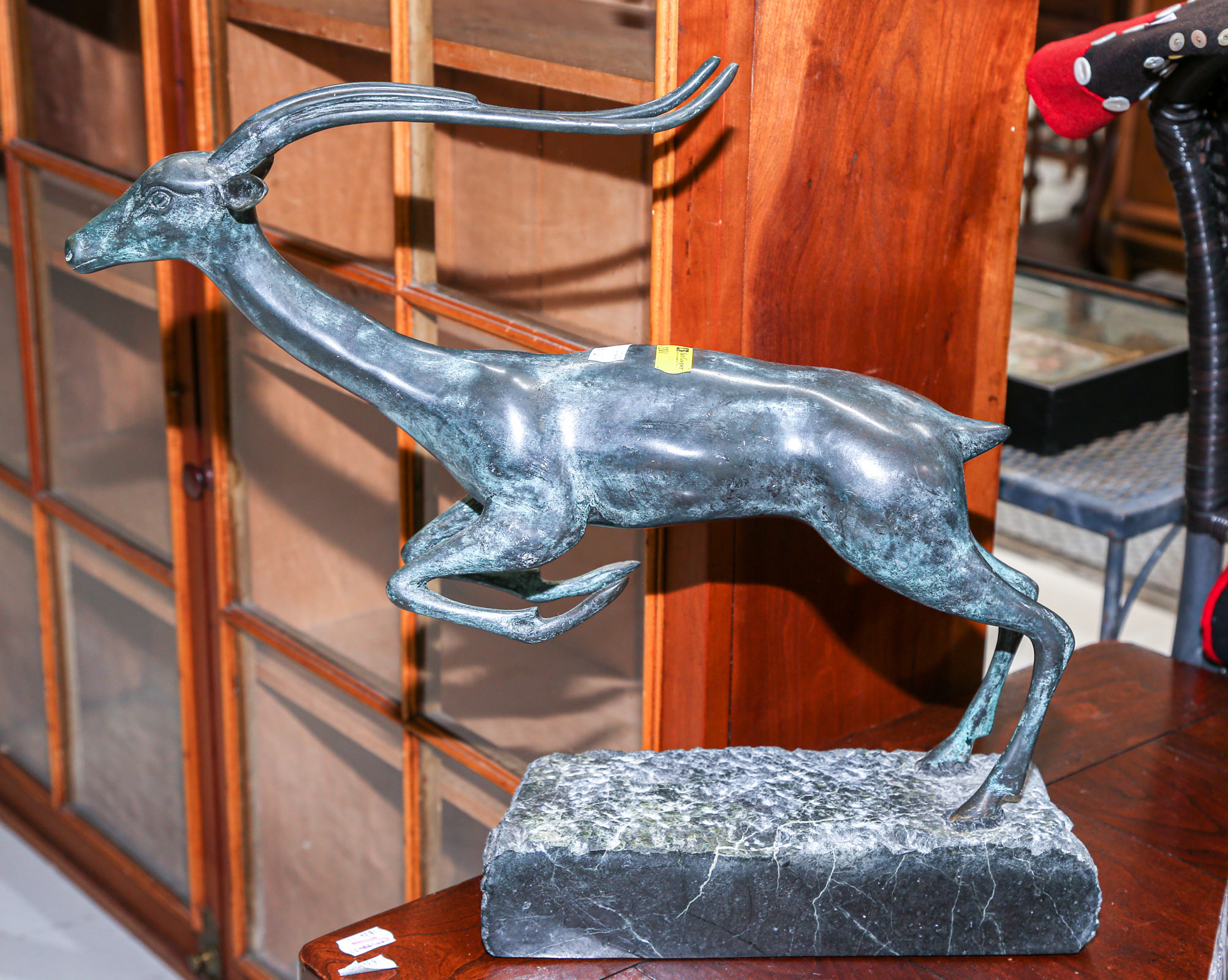 Appraisal: ART DECO BRONZE SCULPTURE OF AFRICAN ANTELOPE Mid th century