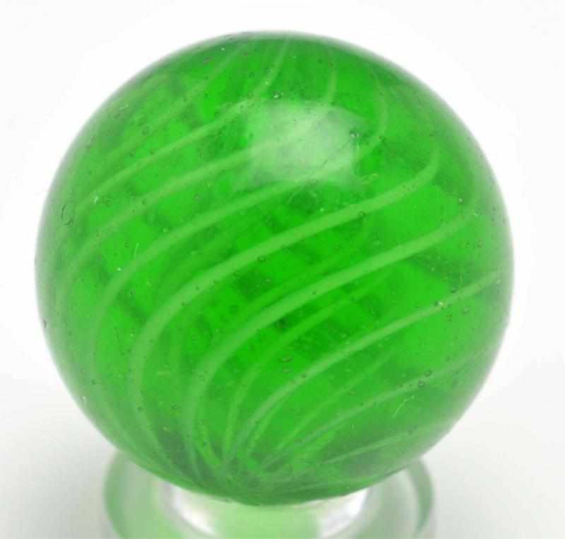 Appraisal: Green Glass Latticino Swirl Marble Description Precision white latticino core