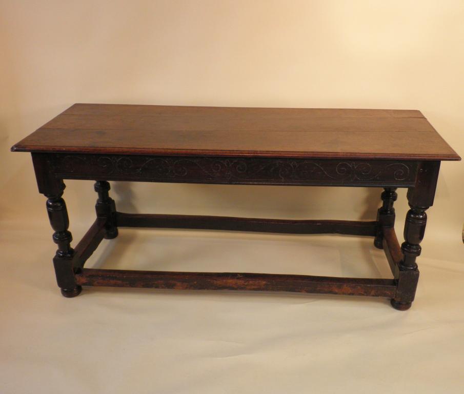 Appraisal: An oak refectory type table the planked top with moulded