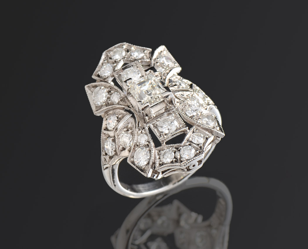 Appraisal: CTW DIAMONDS PLATINUM ART DECO REVIVAL RING This eye catching