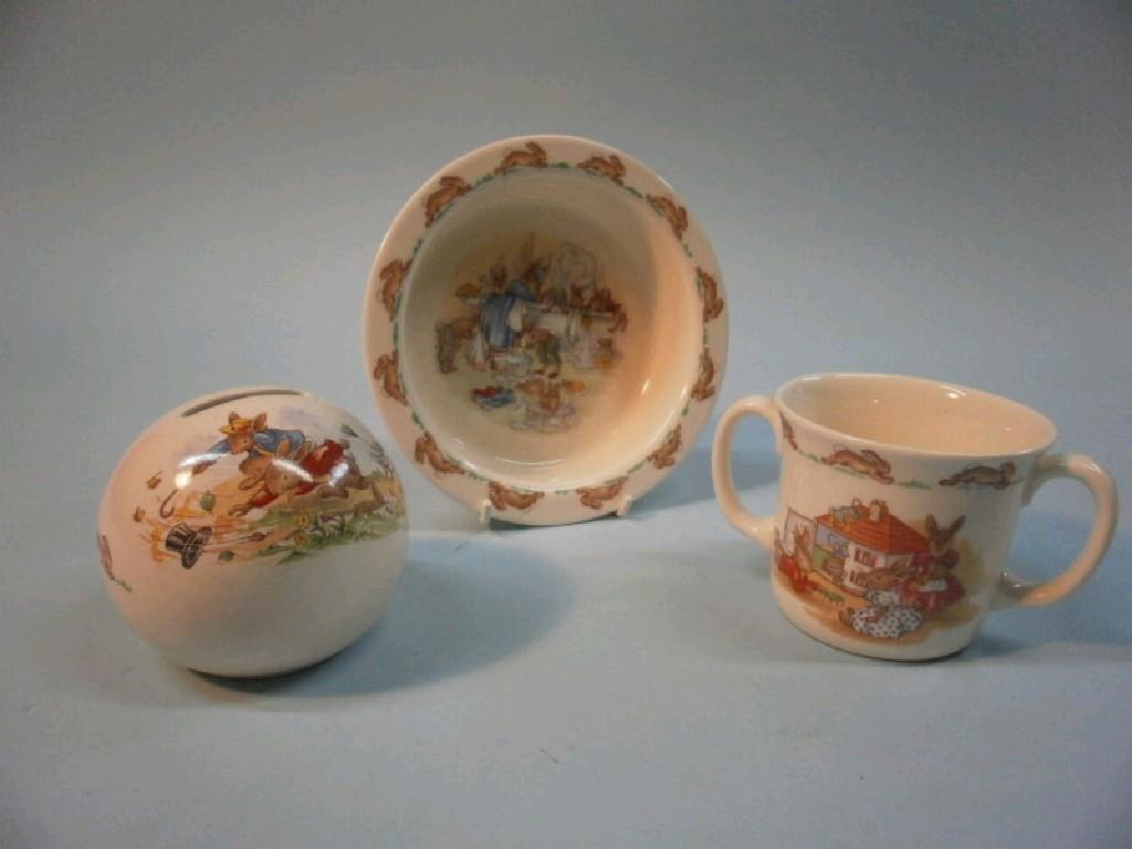 Appraisal: A Royal Doulton Bunnykins two-handled loving cup a money box