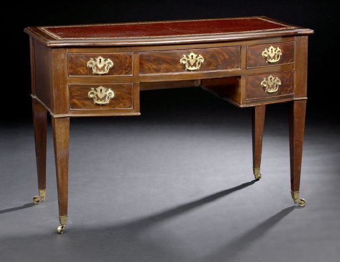 Appraisal: George III-Style Mahogany Desk ca the bowed top with an