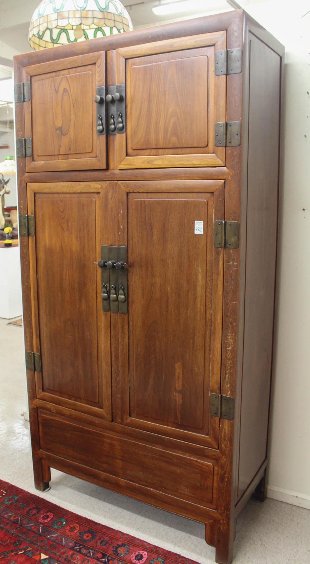 Appraisal: TALL CHINESE MING-STYLE ELMWOOD CABINET two-level design with upper and