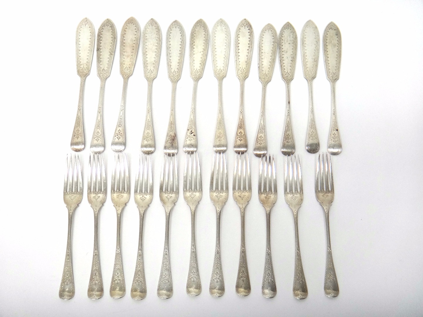 Appraisal: Twelve Victorian silver Old English pattern fish knives and eleven