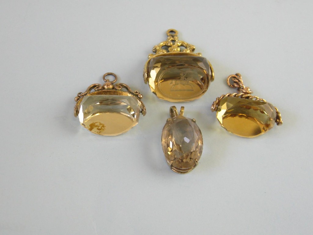 Appraisal: Three Citrine Fobs with ct gold mounts and a Citrine