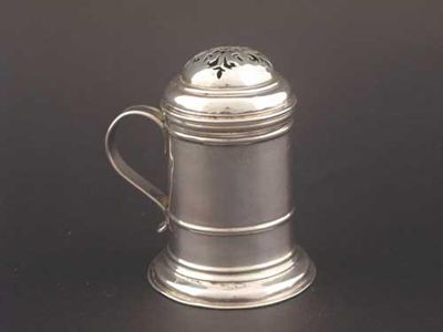 Appraisal: A George I kitchen pepper with a skirted base scroll