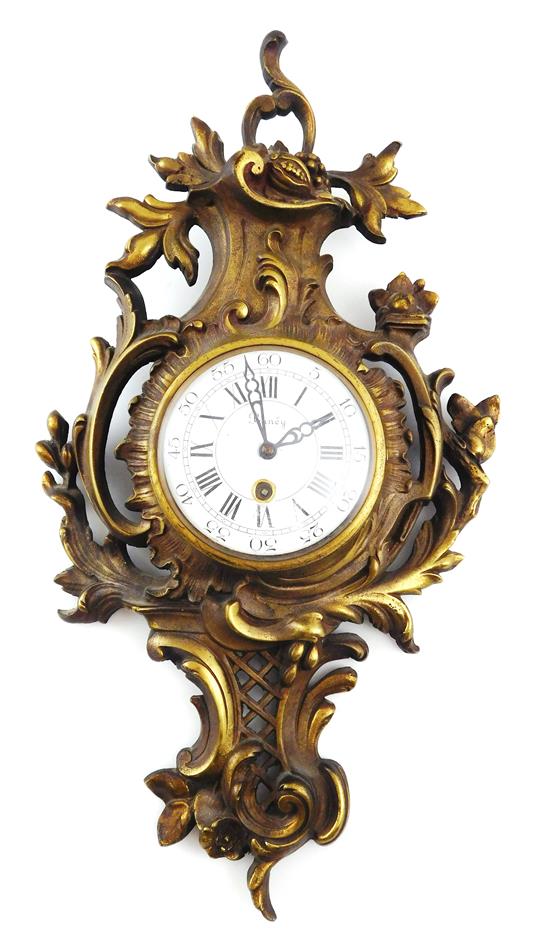 Appraisal: CLOCK Rococo style cartel clock brass-finished case with foliate scroll