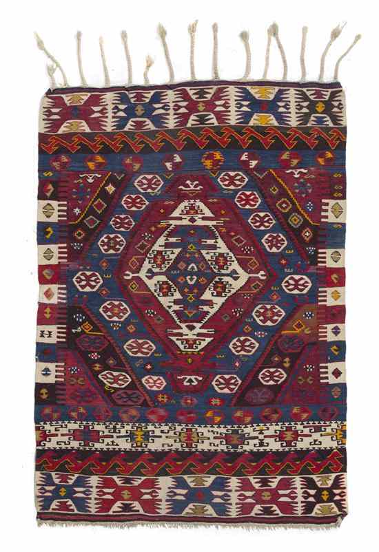 Appraisal: A Kilim Flatweave Carpet having a geometric center medallion within