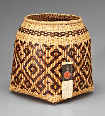 Appraisal: Rowena Bradley river cane basket square-to-round design wastebasket butternut and