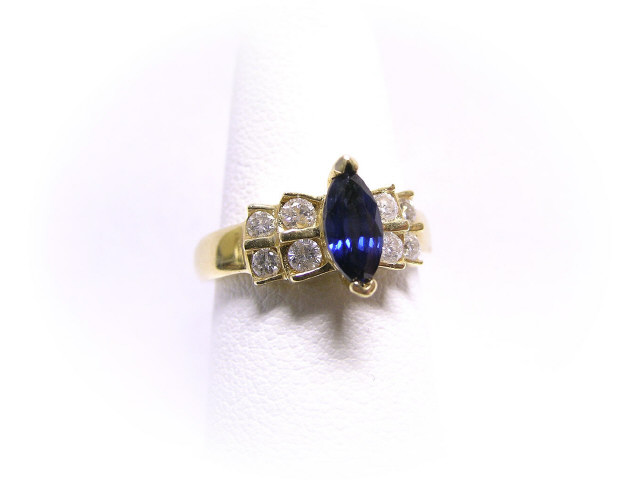 Appraisal: Lady's K yellow gold ring set with marquis-cut sapphire and