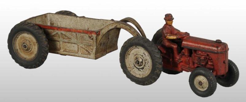 Appraisal: Cast Iron Arcade Tractor Toy with Wagon Description All original