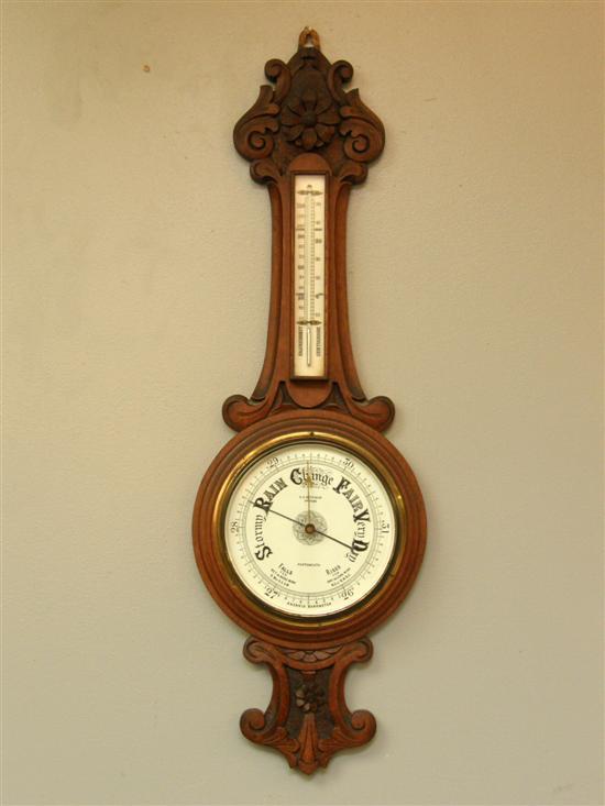 Appraisal: Early twentieth century advertising carved banjo shaped barometer the dial