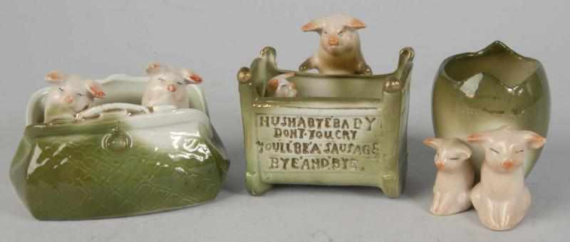 Appraisal: Lot of German Porcelain Pig Novelties Description Two pigs in