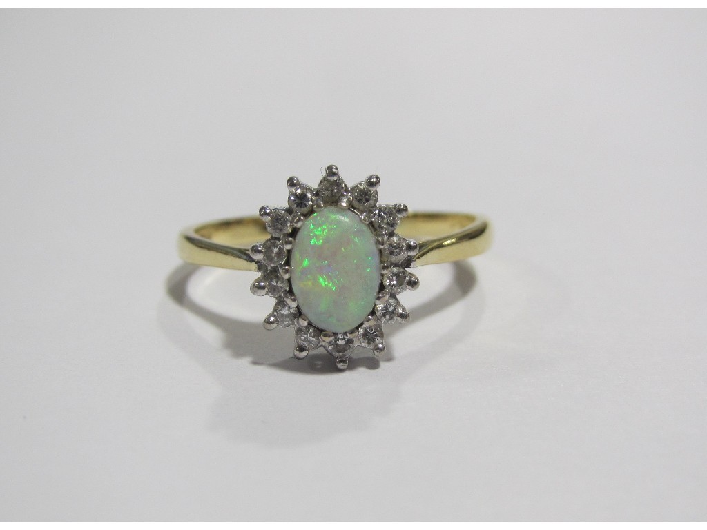 Appraisal: Eighteen carat gold opal and diamond cluster ring