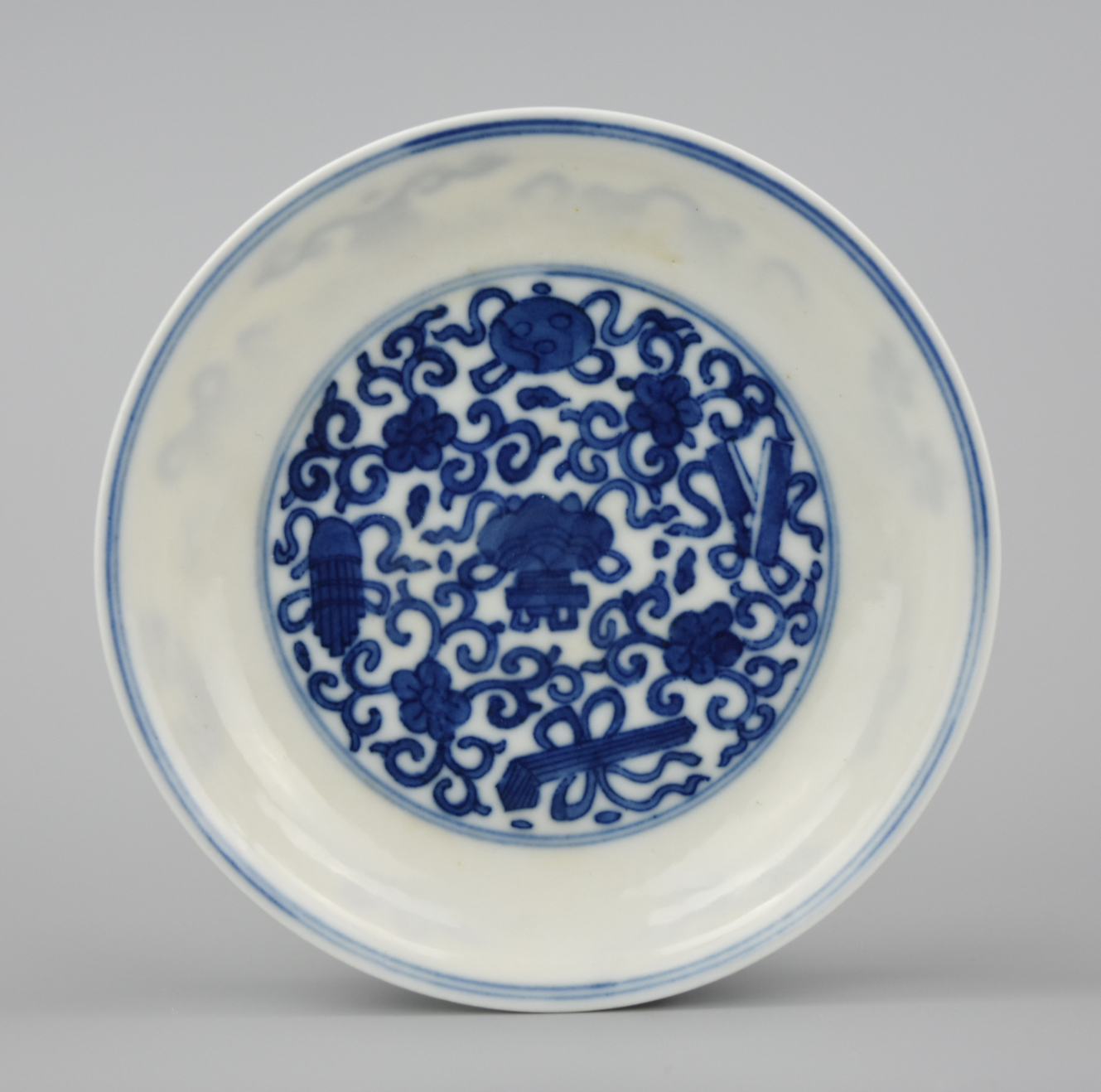 Appraisal: SMALL CHINESE B W PLATE W ARTIFACTS KANGXI P A