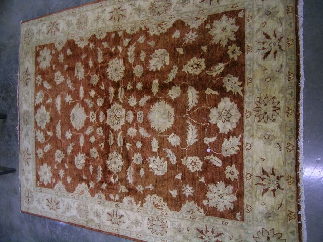 Appraisal: Hand-made oriental-style rug leaf motif decoration with gold and russet