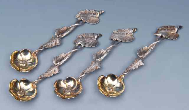 Appraisal: A SET OF FOUR VICTORIAN SILVER TEASPOONS with flower head