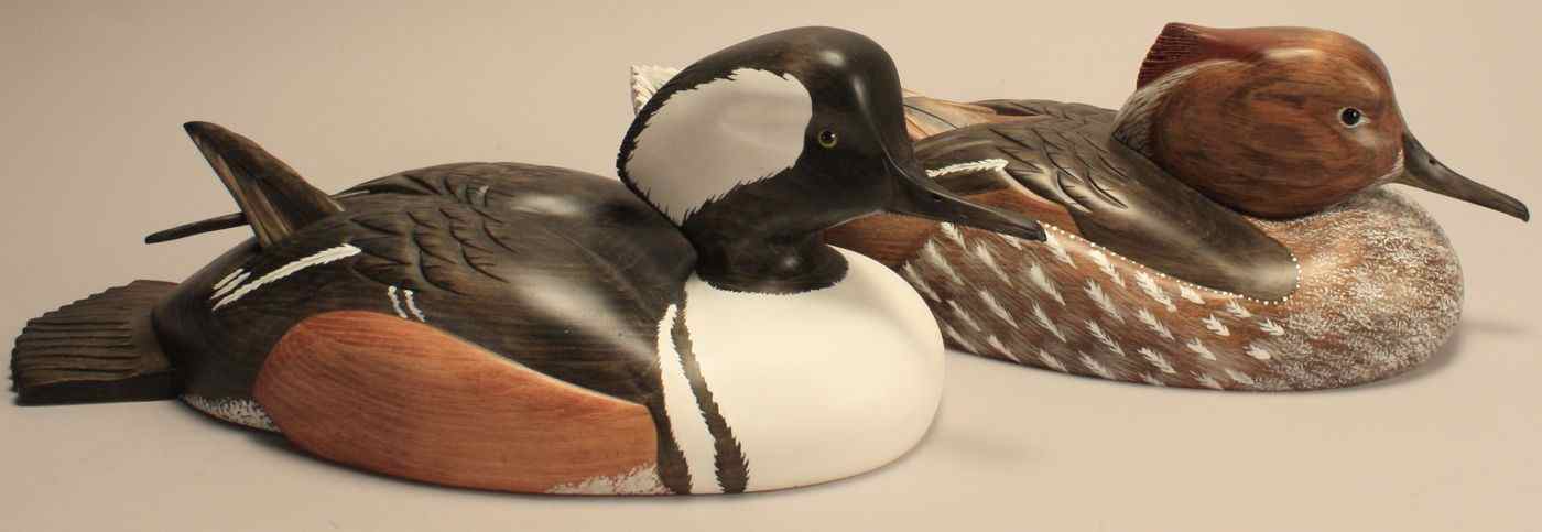 Appraisal: PAIR OF OVERSIZE HOODED MERGANSER CARVINGSBy Robert Kelly of Ontario