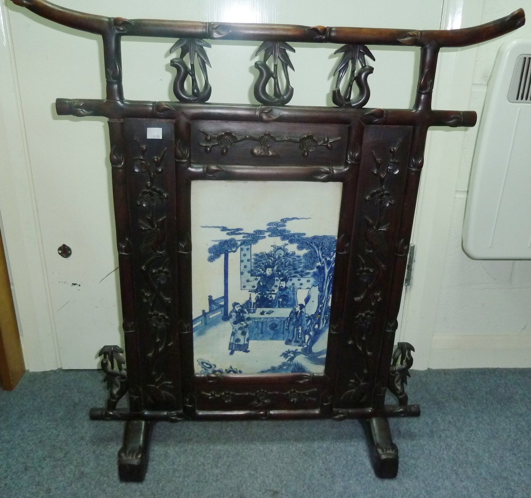 Appraisal: A Chinese porcelain mounted screen th th Century the central