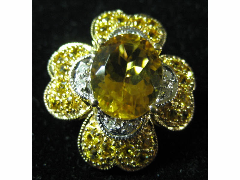 Appraisal: CITRINE AND YELLOW SAPPHIRE PENDANT Yellow gold four leaf clover