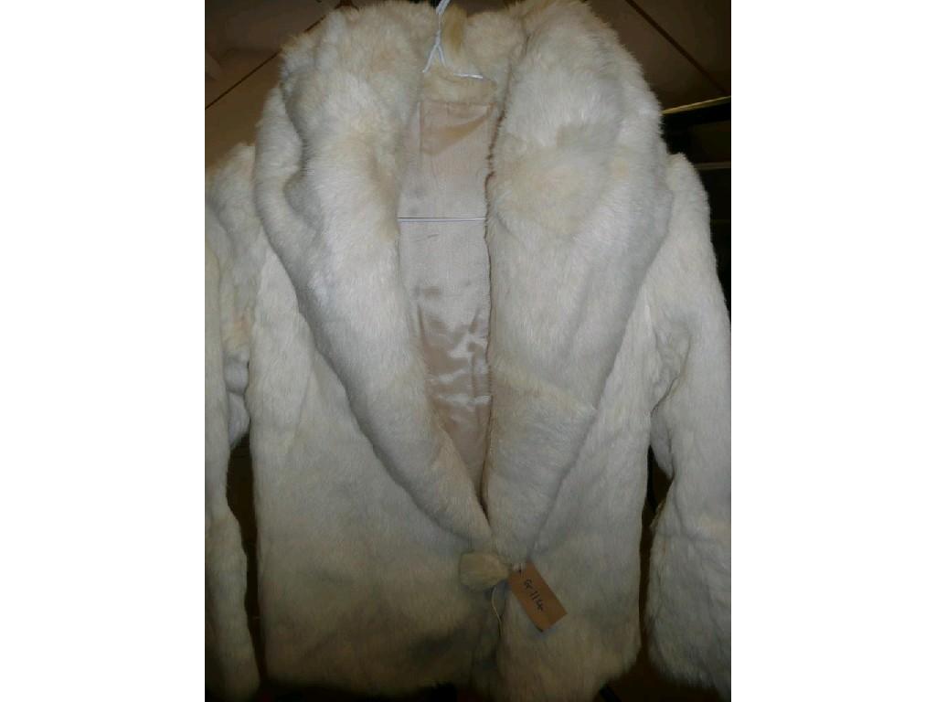 Appraisal: A cream fur jacket with large collar and satin lined