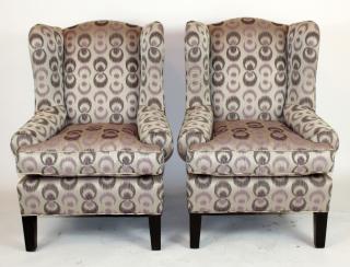 Appraisal: Pair of wingback upholstered armchairs A pair of wingback upholstered