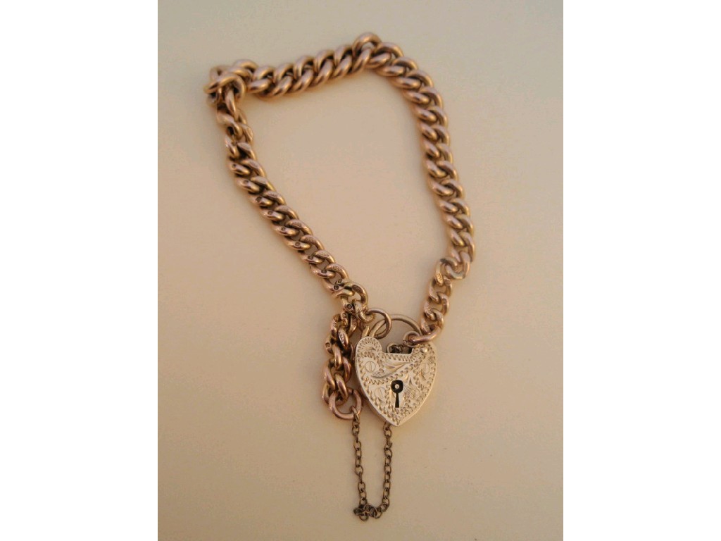 Appraisal: A ct gold curb link bracelet with padlock clasp g