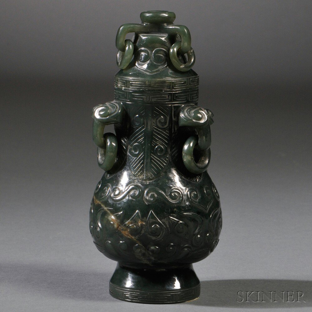 Appraisal: Stone Covered Vase China the bottle-shaped body rising from a