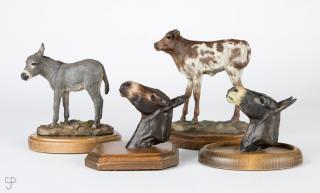 Appraisal: Vel Miller Four painted bronzes standing calf standing burro and