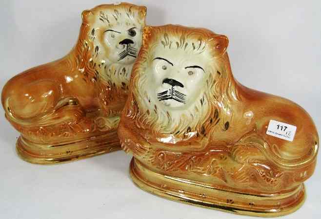 Appraisal: Pair of th Century Staffordshire fireside Lions Height cm