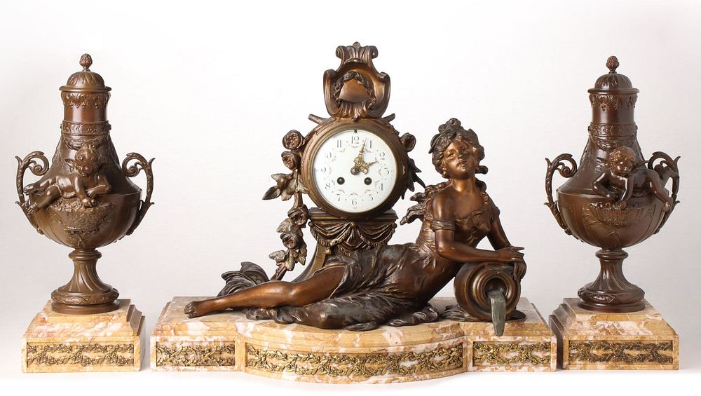 Appraisal: A TH C STATUE CLOCK GARNITURE AFTER LOUIS MOREAU The