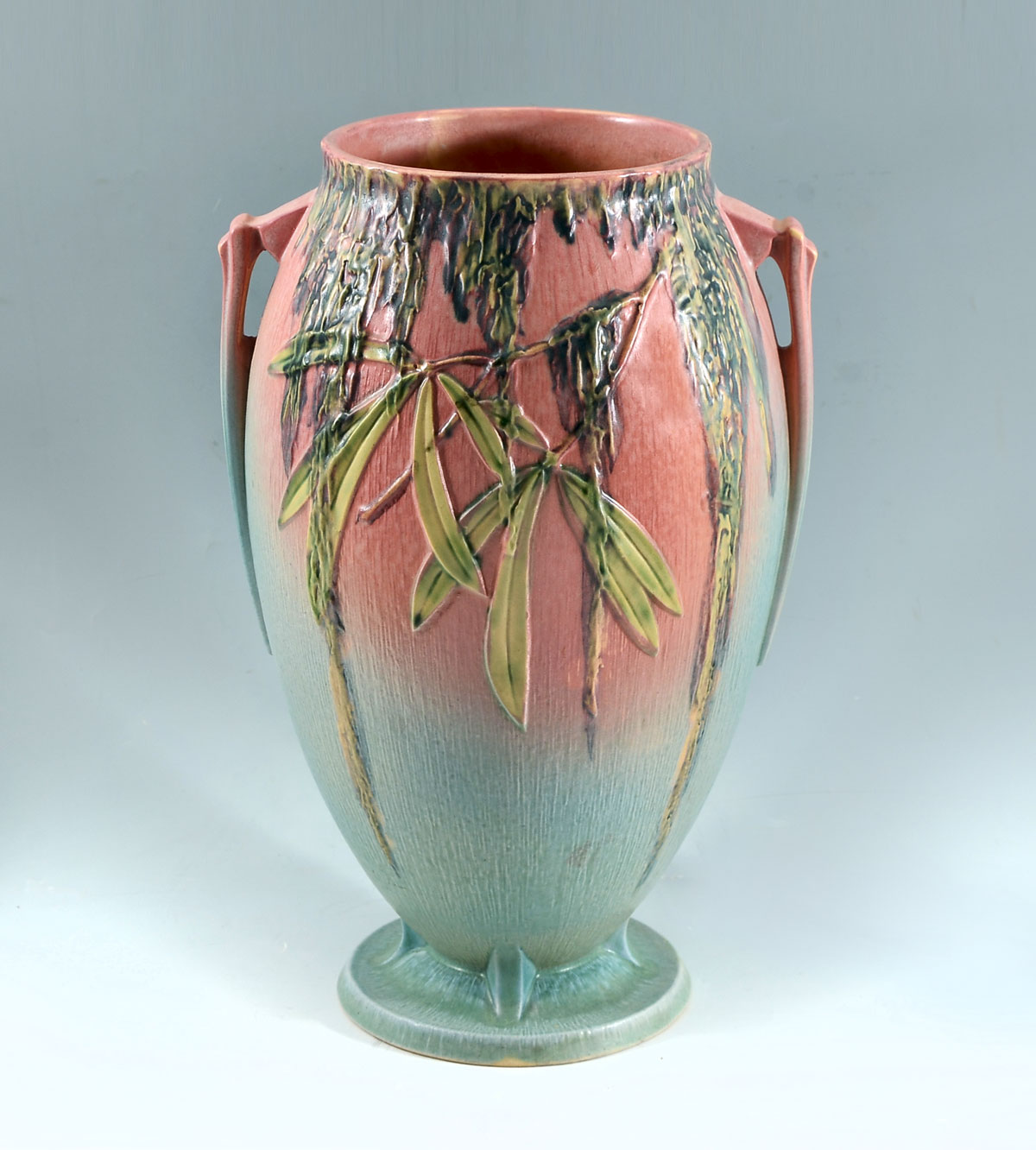 Appraisal: PINK MOSS ROSEVILLE ART POTTERY VASE Art pottery handled vase