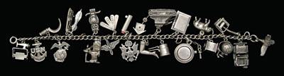 Appraisal: WWII silver charm bracelet charms including bird jeep globe working